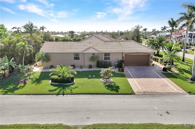2801 SW 29th Ct, Cape Coral, FL 33914 - single story home featuring stucco siding, a garage, decorative driveway, and a tiled roof