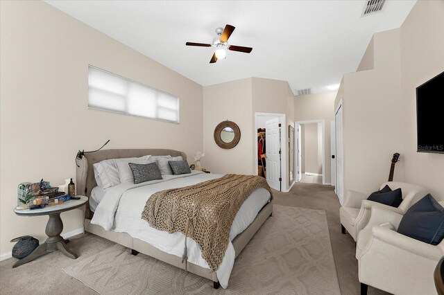 21705 67th Ave E, Bradenton, FL 34211 - bedroom with carpet, a closet, a ceiling fan, and a walk in closet