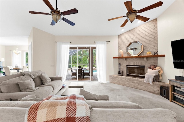 21705 67th Ave E, Bradenton, FL 34211 - living area with lofted ceiling, carpet flooring, ceiling fan, a fireplace, and recessed lighting
