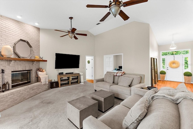 21705 67th Ave E, Bradenton, FL 34211 - living room featuring ceiling fan, a brick fireplace, high vaulted ceiling, and carpet floors