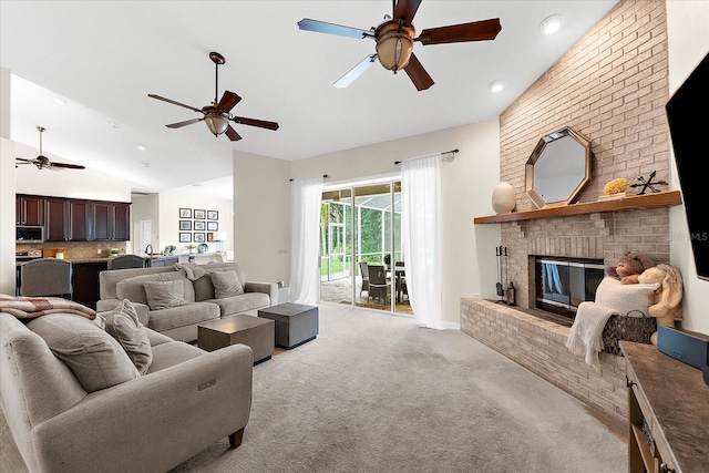 21705 67th Ave E, Bradenton, FL 34211 - living area with vaulted ceiling, ceiling fan, light colored carpet, a fireplace, and recessed lighting