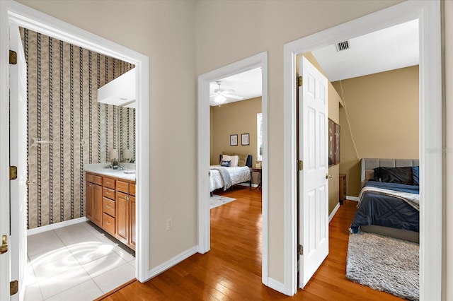 21705 67th Ave E, Bradenton, FL 34211 - ensuite bathroom with vanity, wood finished floors, and a ceiling fan