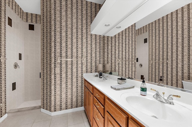 21705 67th Ave E, Bradenton, FL 34211 - bathroom featuring a stall shower, double vanity, tile patterned flooring, and wallpapered walls