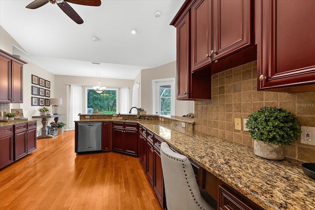 21705 67th Ave E, Bradenton, FL 34211 - kitchen featuring dishwasher, ceiling fan, light wood-style flooring, dark brown cabinets, and backsplash
