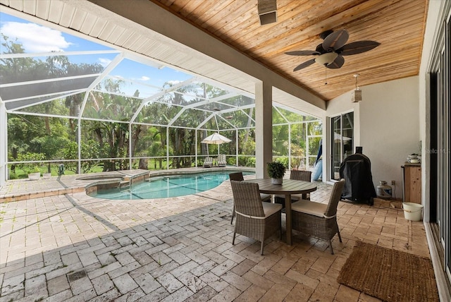 21705 67th Ave E, Bradenton, FL 34211 - view of pool with a patio area, a pool with connected hot tub, a ceiling fan, and glass enclosure