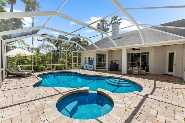 21705 67th Ave E, Bradenton, FL 34211 - view of pool with a pool with connected hot tub, a patio area, a ceiling fan, and glass enclosure
