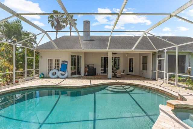 21705 67th Ave E, Bradenton, FL 34211 - view of swimming pool featuring glass enclosure, a patio, and a pool with connected hot tub
