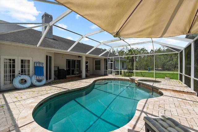 21705 67th Ave E, Bradenton, FL 34211 - view of swimming pool featuring a patio, ceiling fan, french doors, a pool with connected hot tub, and glass enclosure