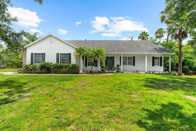 21705 67th Ave E, Bradenton, FL 34211 - single story home with a front yard, a porch, stucco siding, and roof with shingles