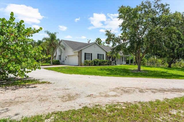 21705 67th Ave E, Bradenton, FL 34211 - single story home with an attached garage, dirt driveway, and a front lawn
