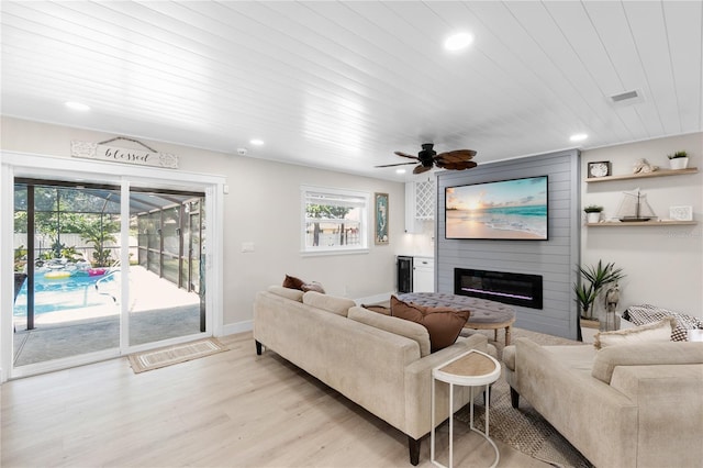 327 Francis Dr, Apollo Beach, FL 33572 - living area featuring recessed lighting, light wood-style flooring, a large fireplace, and ceiling fan