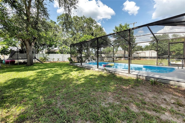 327 Francis Dr, Apollo Beach, FL 33572 - fenced backyard featuring a storage shed and glass enclosure