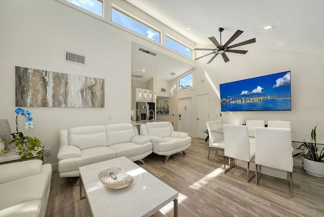 718 White Pine Tree Rd Unit 80, Venice, FL 34285 - living area featuring a high ceiling, ceiling fan, and wood finished floors