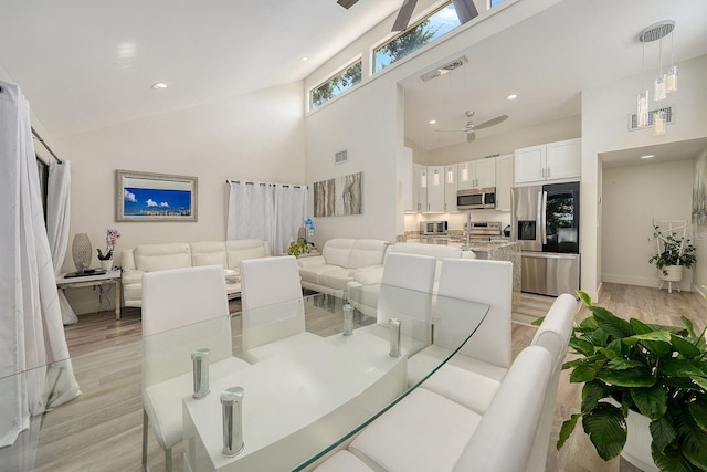 718 White Pine Tree Rd Unit 80, Venice, FL 34285 - dining room with a towering ceiling, light wood-style floors, recessed lighting, and a ceiling fan