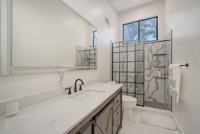 718 White Pine Tree Rd Unit 80, Venice, FL 34285 - bathroom featuring vanity, a marble finish shower, and marble finish floors