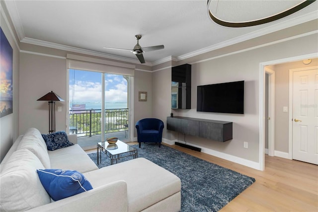 750 N Tamiami Trl Unit 1005, Sarasota, FL 34236 - living room with crown molding, wood finished floors, and ceiling fan