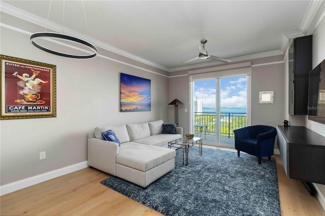 750 N Tamiami Trl Unit 1005, Sarasota, FL 34236 - living area with wood finished floors, crown molding, and a ceiling fan