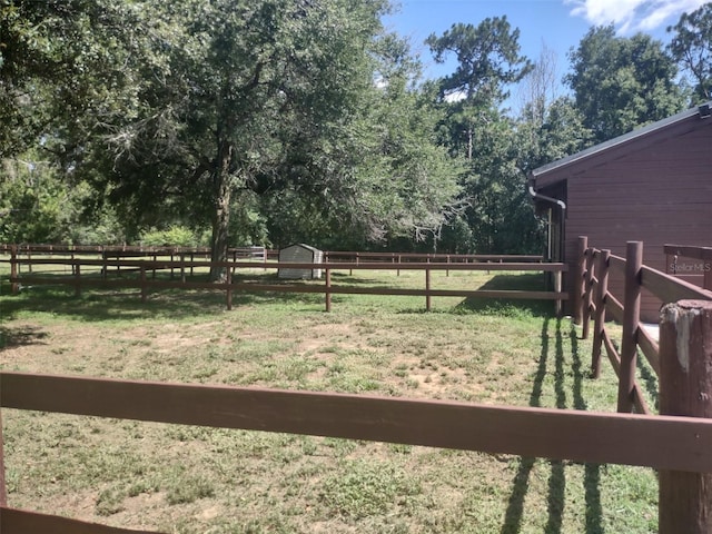 8851 S Brittany Path, Inverness, FL 34452 - fenced backyard with a shed and a view of countryside