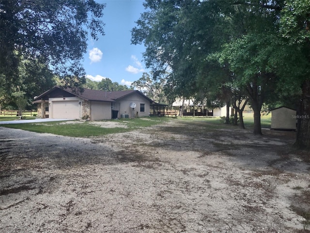 8851 S Brittany Path, Inverness, FL 34452 - view of property exterior with an attached garage and driveway