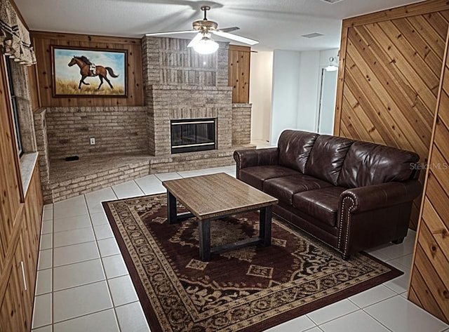8851 S Brittany Path, Inverness, FL 34452 - tiled living room with a ceiling fan, a brick fireplace, and wood walls