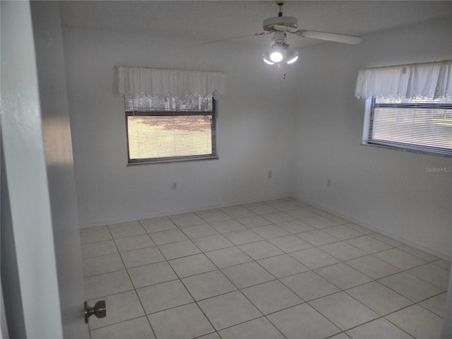 8851 S Brittany Path, Inverness, FL 34452 - empty room with ceiling fan and light tile patterned floors