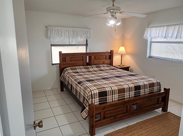 8851 S Brittany Path, Inverness, FL 34452 - bedroom featuring multiple windows, tile patterned flooring, and a ceiling fan