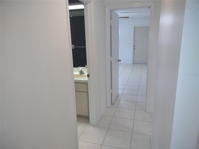 8851 S Brittany Path, Inverness, FL 34452 - hallway featuring light tile patterned floors and a sink