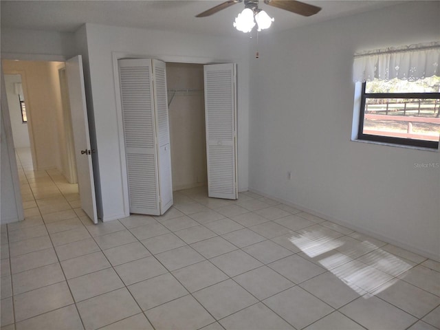 8851 S Brittany Path, Inverness, FL 34452 - unfurnished bedroom featuring light tile patterned floors, a closet, and ceiling fan