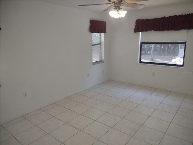 8851 S Brittany Path, Inverness, FL 34452 - empty room with ceiling fan and light tile patterned flooring