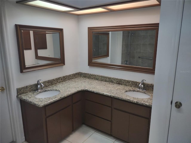8851 S Brittany Path, Inverness, FL 34452 - full bathroom with double vanity, tile patterned flooring, and a tile shower