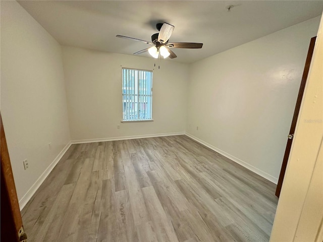 2360 SW Archer Rd Unit 206, Gainesville, FL 32608 - empty room with light wood-style floors and a ceiling fan