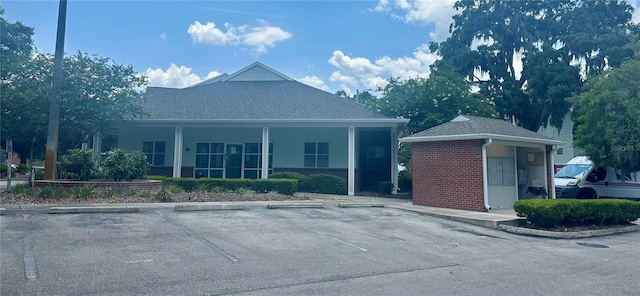 2360 SW Archer Rd Unit 206, Gainesville, FL 32608 - view of property featuring uncovered parking