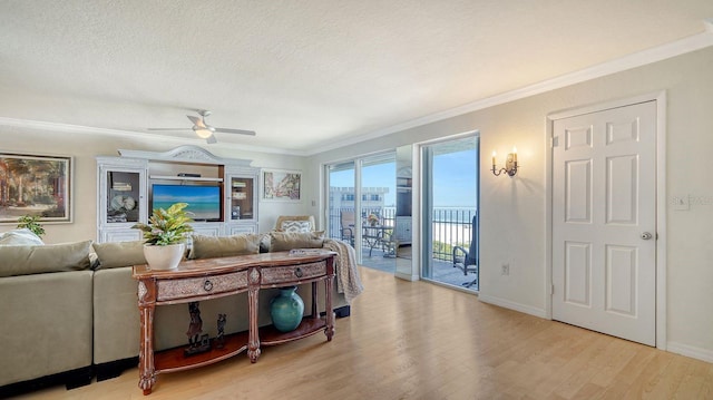 1 Benjamin Franklin Dr Unit 93, Sarasota, FL 34236 - living area with wood finished floors, a ceiling fan, crown molding, and a textured ceiling