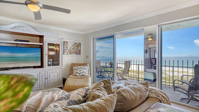1 Benjamin Franklin Dr Unit 93, Sarasota, FL 34236 - living room featuring a ceiling fan, ornamental molding, and a water view