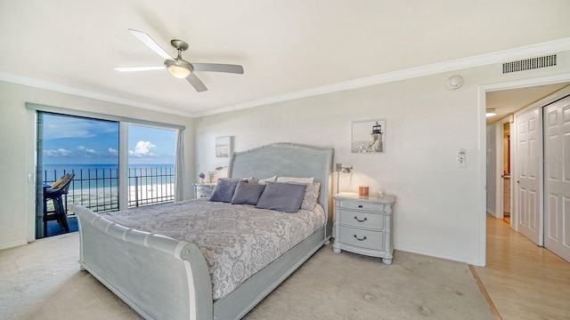 1 Benjamin Franklin Dr Unit 93, Sarasota, FL 34236 - bedroom with access to outside, ornamental molding, a water view, ceiling fan, and light carpet