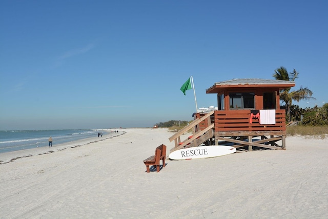 1 Benjamin Franklin Dr Unit 93, Sarasota, FL 34236 - view of playground featuring view of water and beach