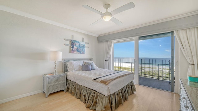 1 Benjamin Franklin Dr Unit 93, Sarasota, FL 34236 - bedroom featuring access to outside, ornamental molding, light wood finished floors, view of water and beach, and ceiling fan
