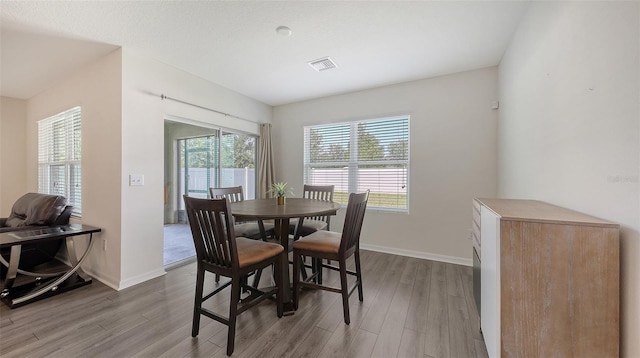 3813 Willow Branch Pl, Palmetto, FL 34221 - dining area featuring wood finished floors
