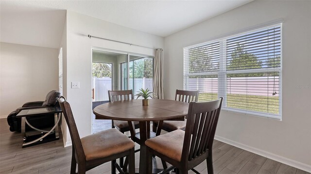 3813 Willow Branch Pl, Palmetto, FL 34221 - dining area featuring wood finished floors and baseboards