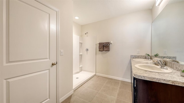 3813 Willow Branch Pl, Palmetto, FL 34221 - bathroom with tile patterned floors, double vanity, and a walk in shower