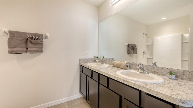 3813 Willow Branch Pl, Palmetto, FL 34221 - bathroom with double vanity, tile patterned floors, and a shower