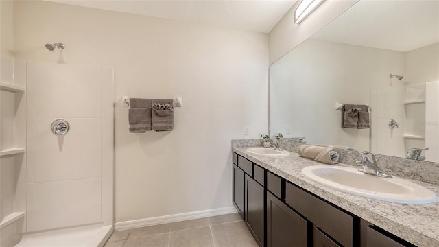 3813 Willow Branch Pl, Palmetto, FL 34221 - bathroom featuring a shower, double vanity, and tile patterned flooring