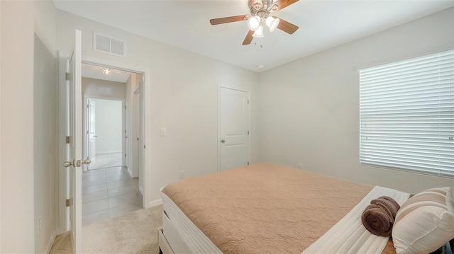 3813 Willow Branch Pl, Palmetto, FL 34221 - bedroom featuring light colored carpet, light tile patterned floors, and ceiling fan