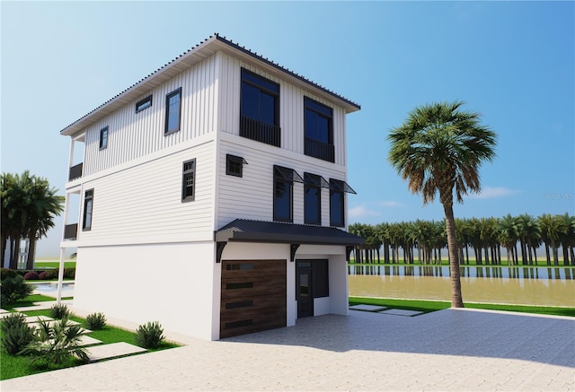 312 Avenida Leona, Sarasota, FL 34242 - view of front of house with board and batten siding and a water view