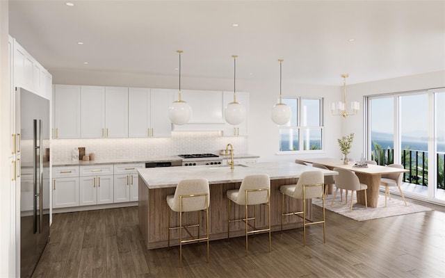 312 Avenida Leona, Sarasota, FL 34242 - kitchen with built in fridge, healthy amount of natural light, tasteful backsplash, dark wood finished floors, and recessed lighting