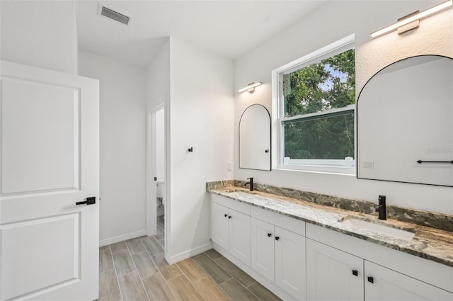 4855 Dragon St, North Port, FL 34288 - full bath featuring double vanity and wood finish floors
