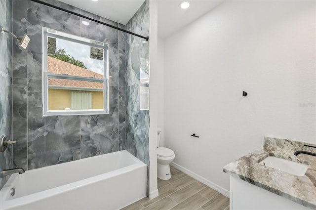 4855 Dragon St, North Port, FL 34288 - bathroom with vanity, bathing tub / shower combination, wood tiled floors, and recessed lighting