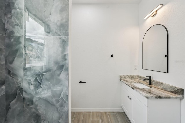 4855 Dragon St, North Port, FL 34288 - full bathroom with vanity, a marble finish shower, and wood finish floors