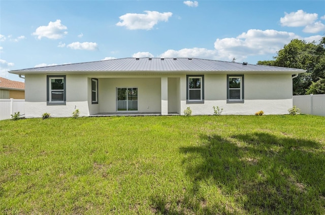 4855 Dragon St, North Port, FL 34288 - back of property featuring stucco siding, a standing seam roof, and a metal roof
