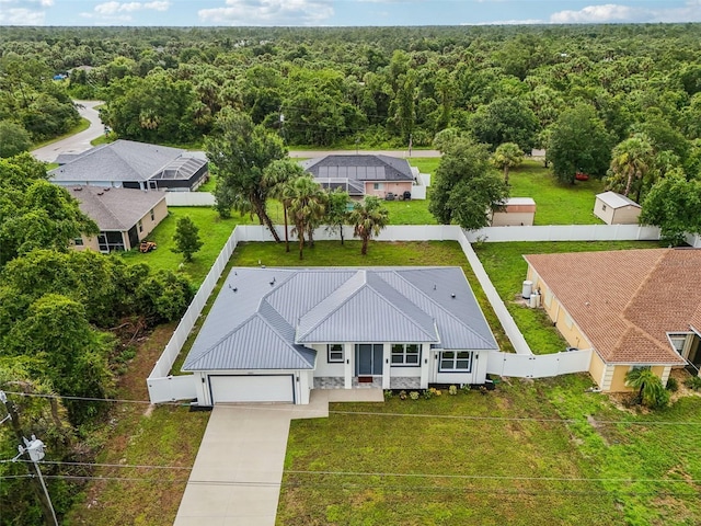 4855 Dragon St, North Port, FL 34288 - aerial view of property and surrounding area with a heavily wooded area